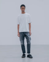 uniform experiment 25A/W DAMAGED DENIM TAPERED-FIT JEANS [ UE-252055 ]